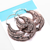 A Pair of Vintage Goddess Leaflet Loops Copper Plug Hoop Earring