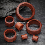 A Pair of Sabo Wood Double Flared Tunnel Plug