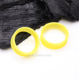 Detail View 1 of A Pair of Ultra Flexible Pastel Yellow Silicone Double Flared Tunnel Plug