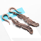 A Pair of Vintage Enchanted Bali Feather Copper Ear Weight Hanger
