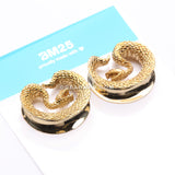A Pair of Golden Brass Vicious Viper Snake Saddle Tunnel Plug