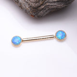 Detail View 1 of A Pair of 14 Karat Gold OneFit™ Threadless Round Fire Opal Bezel Set Nipple Barbell-Blue Opal