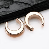 A Pair of Rose Gold Classic Saddle Spreader Double Flared Ear Plug