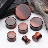 A Pair of Red Tiger Eye Stone Double Flared Ear Gauge Plug