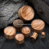 A Pair of Olive Wood Concave Organic Double Flared Plug-Orange/Brown